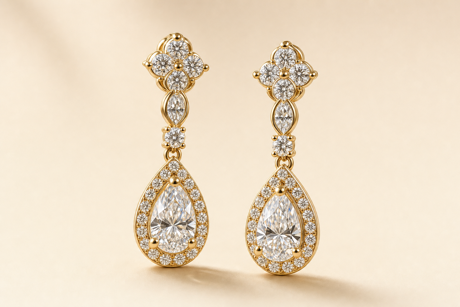 Pair of ornate gold and diamond drop earrings