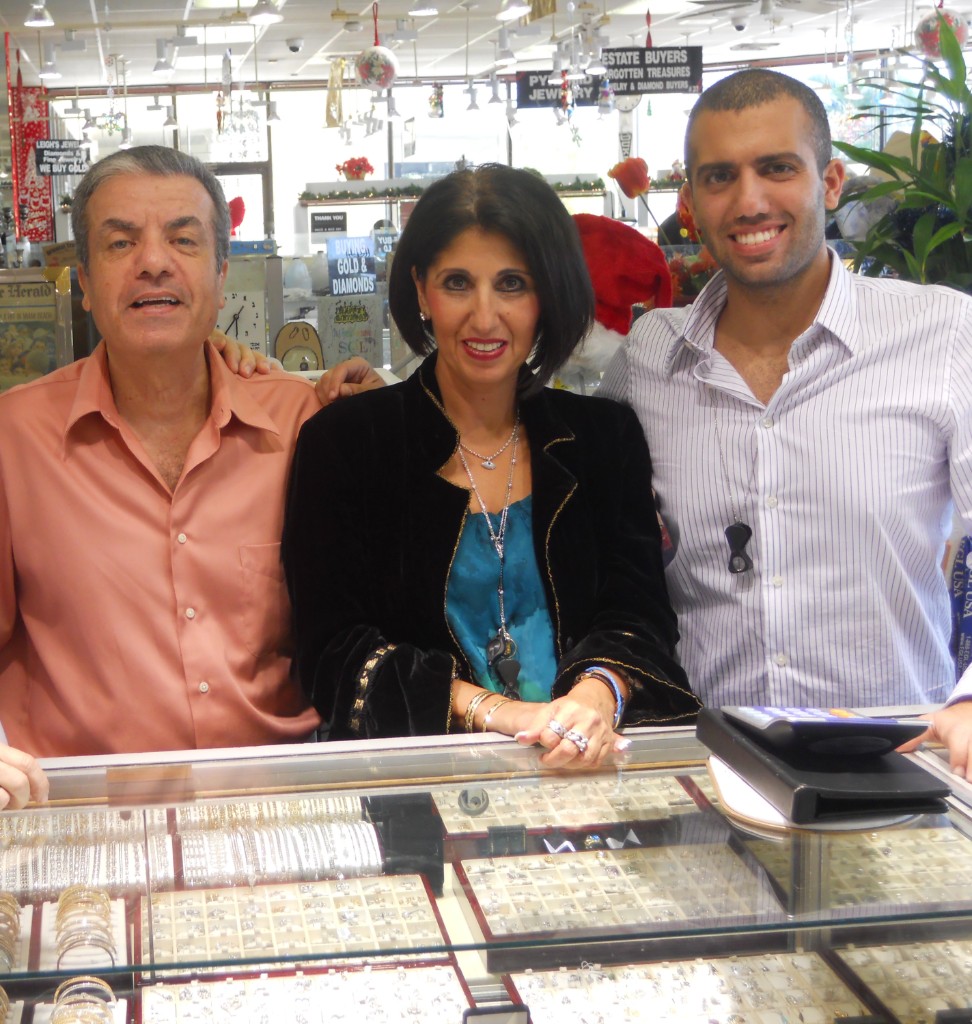 Sol, Orna, and Joey behind the jewelry counter at Sol's Jewelry